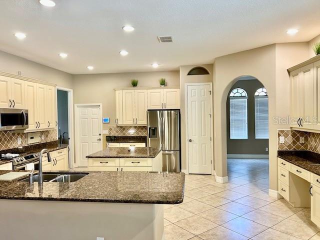 Kitchen Area with Built In Desk and TV