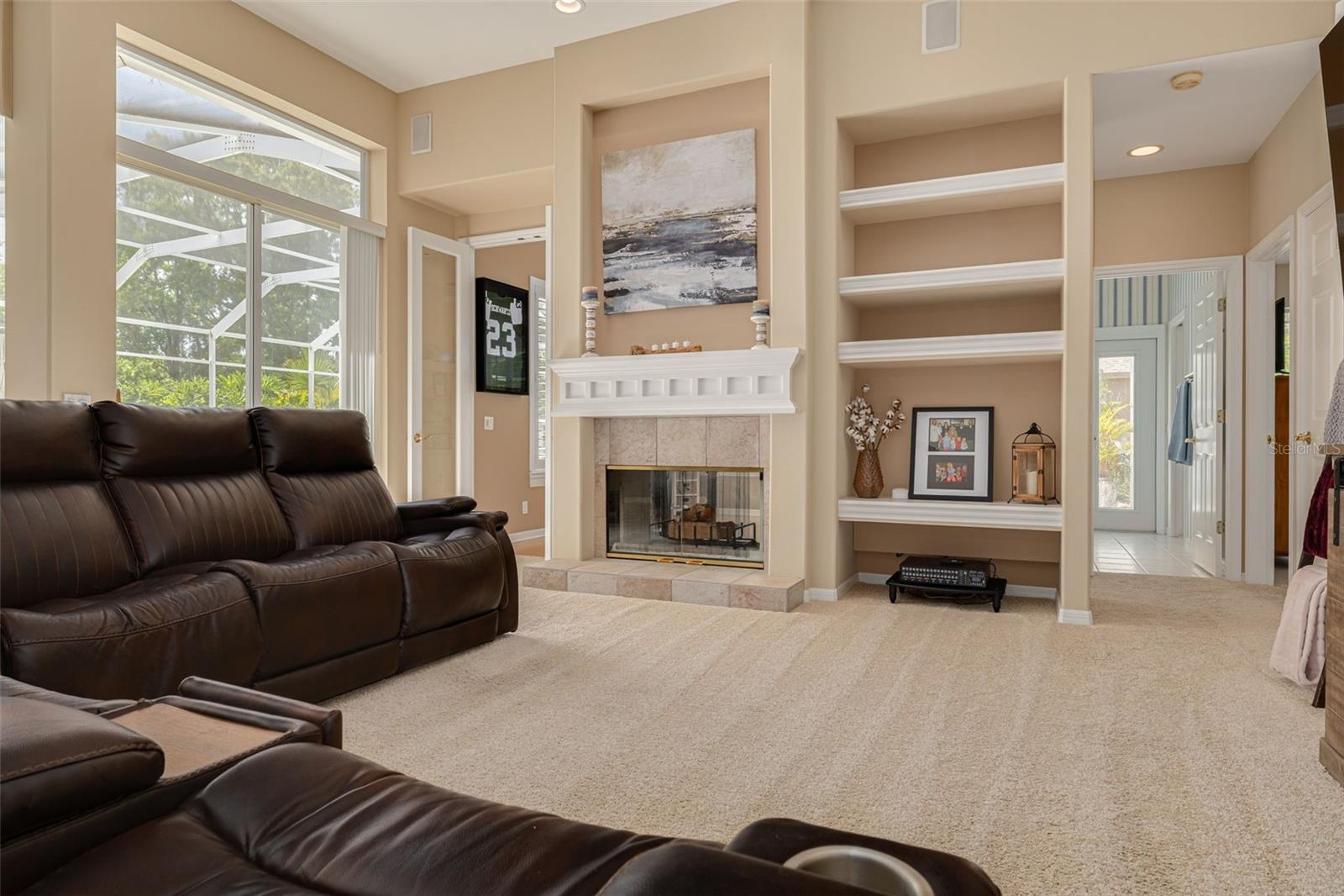 Dual fireplace between family room and bonus room, plus fourth bedroom and pool baht!