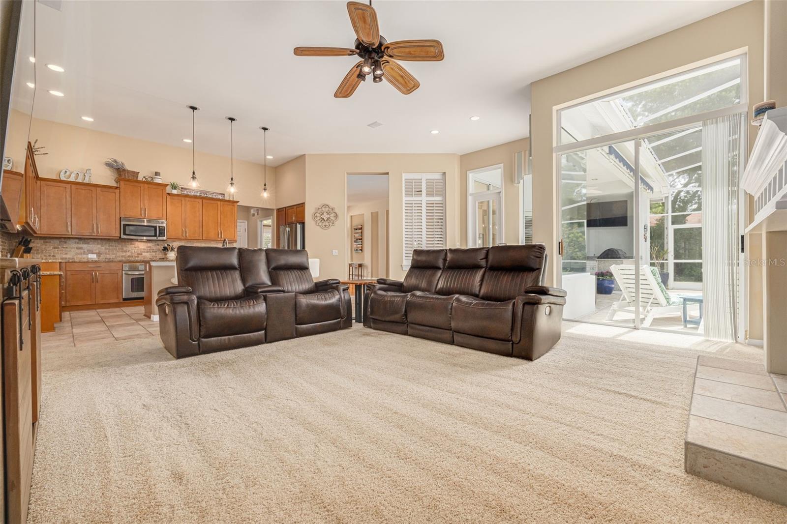 Sliders from family room to the covered lanai, pool and spa!