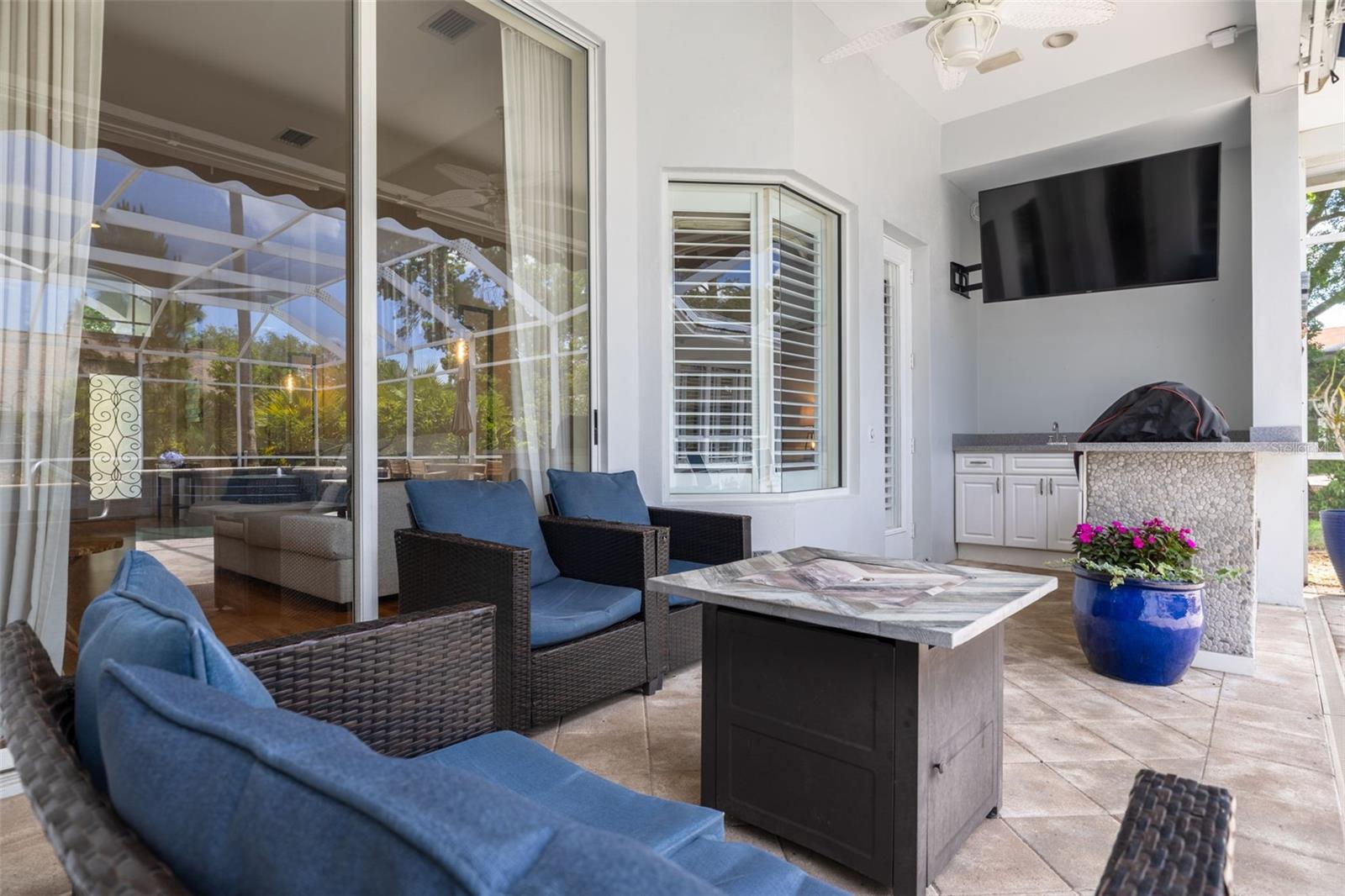 Cozy outdoor lounge area with TV (stays!) and brand new BBQ!