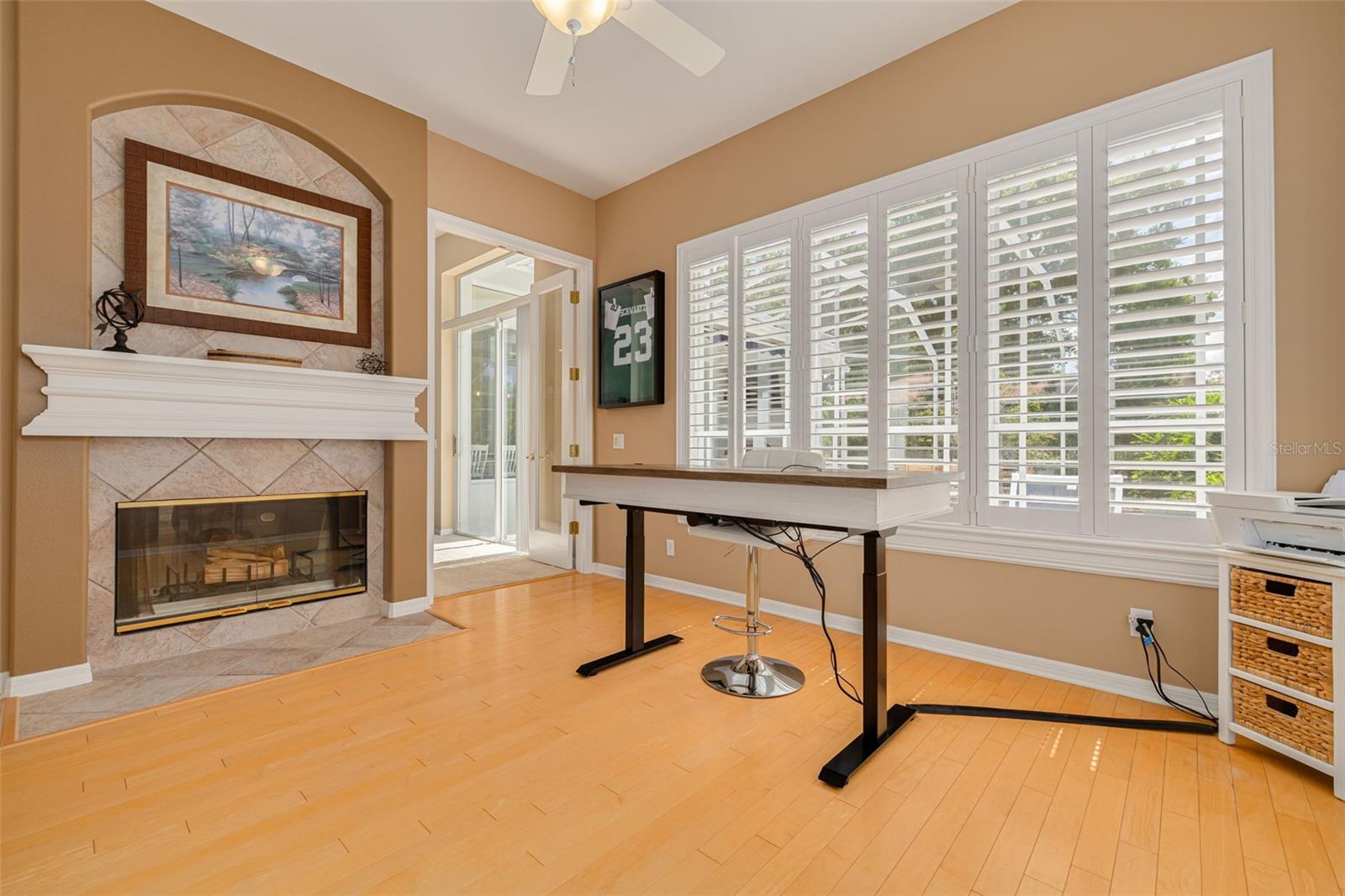 Dual-sided fireplace from bonus room to the family room.