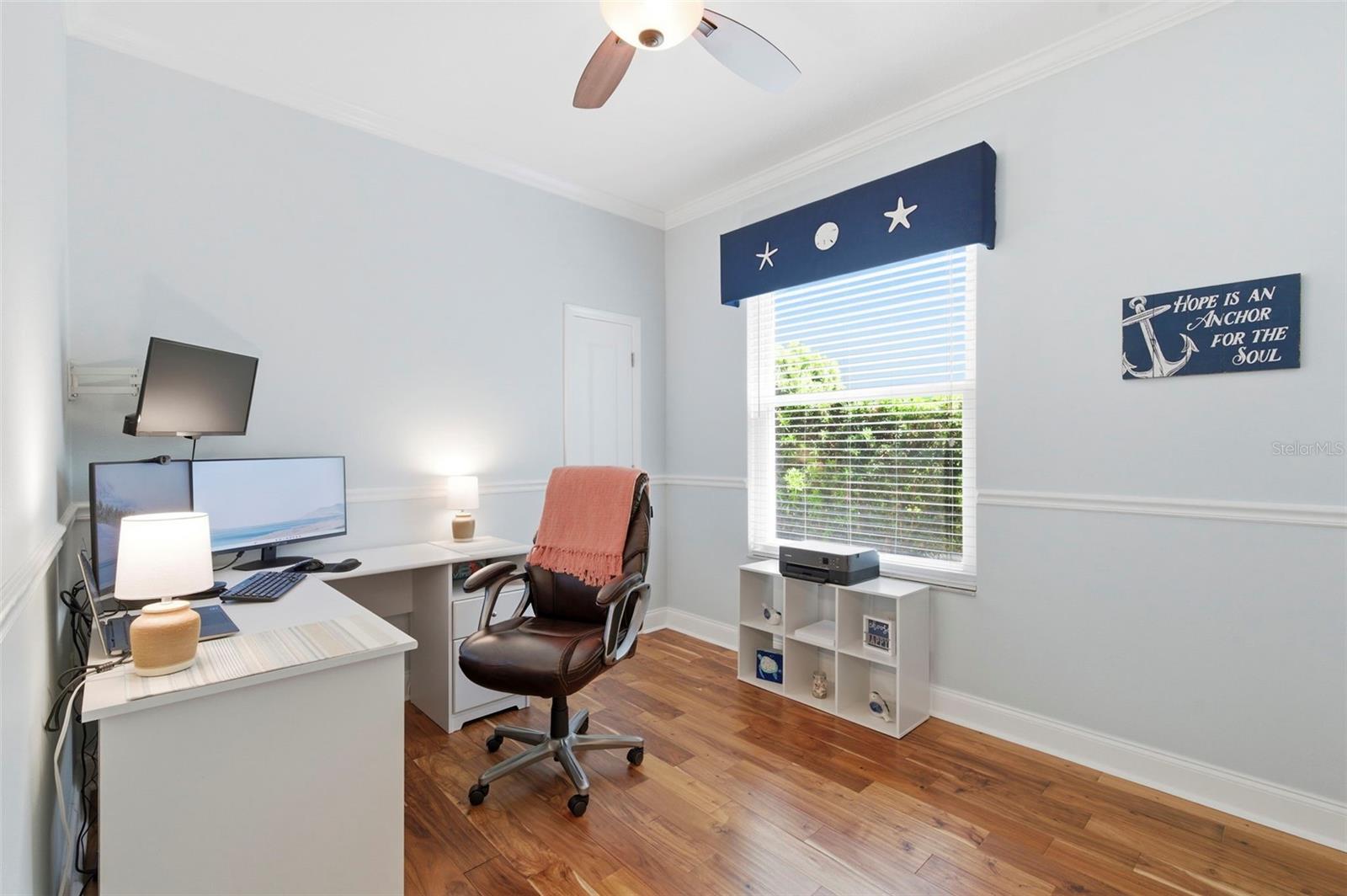 Versatile home office or flex space featuring rich wood flooring, natural light, and a quiet, private setting—ideal for working from home, studying, or creating a dedicated workspace. This room easily adapts to your needs, whether as an office, guest room, or hobby space.