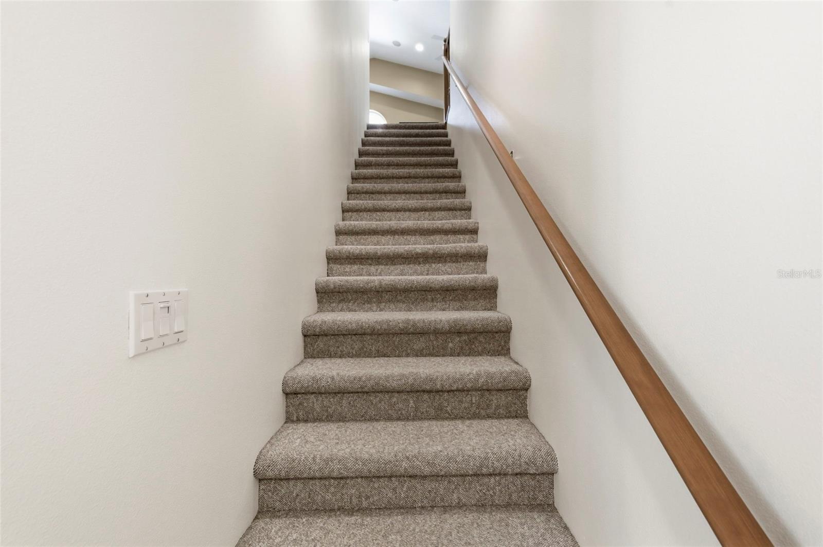 Going up the stairs you will find an expansive bonus room and extra attic storage.