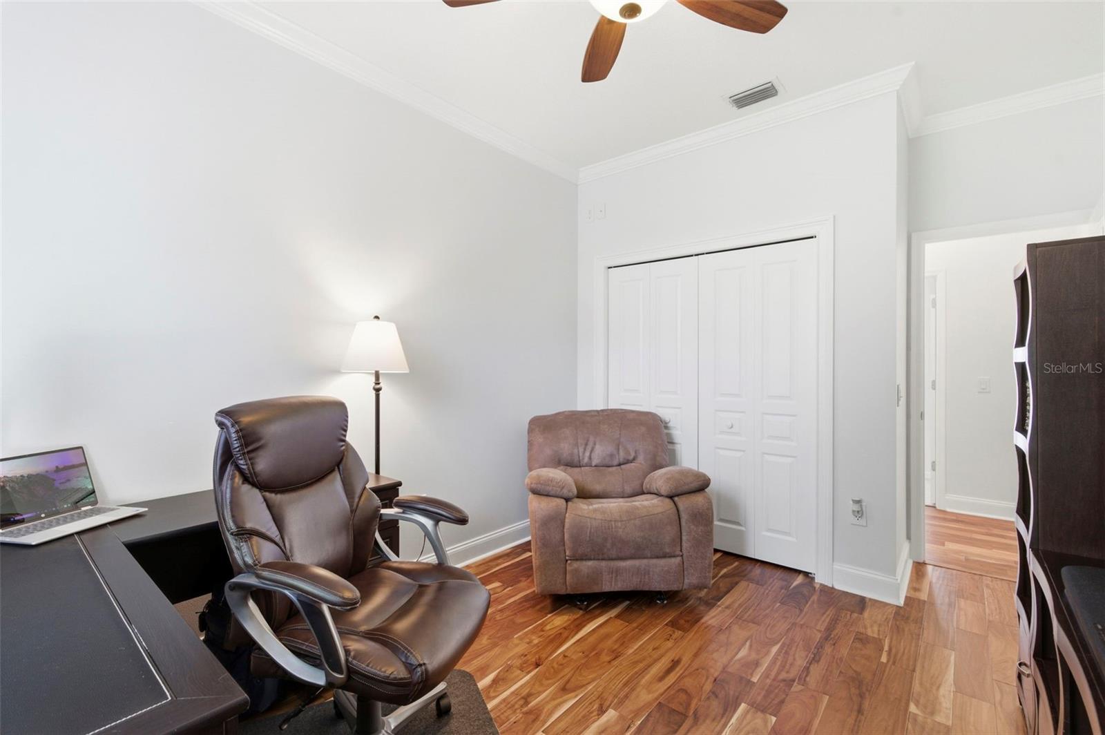 Versatile home office or flex space featuring rich wood flooring, natural light, and a quiet, private setting—ideal for working from home, studying, or creating a dedicated workspace. This room easily adapts to your needs, whether as an office, guest room, or hobby space.