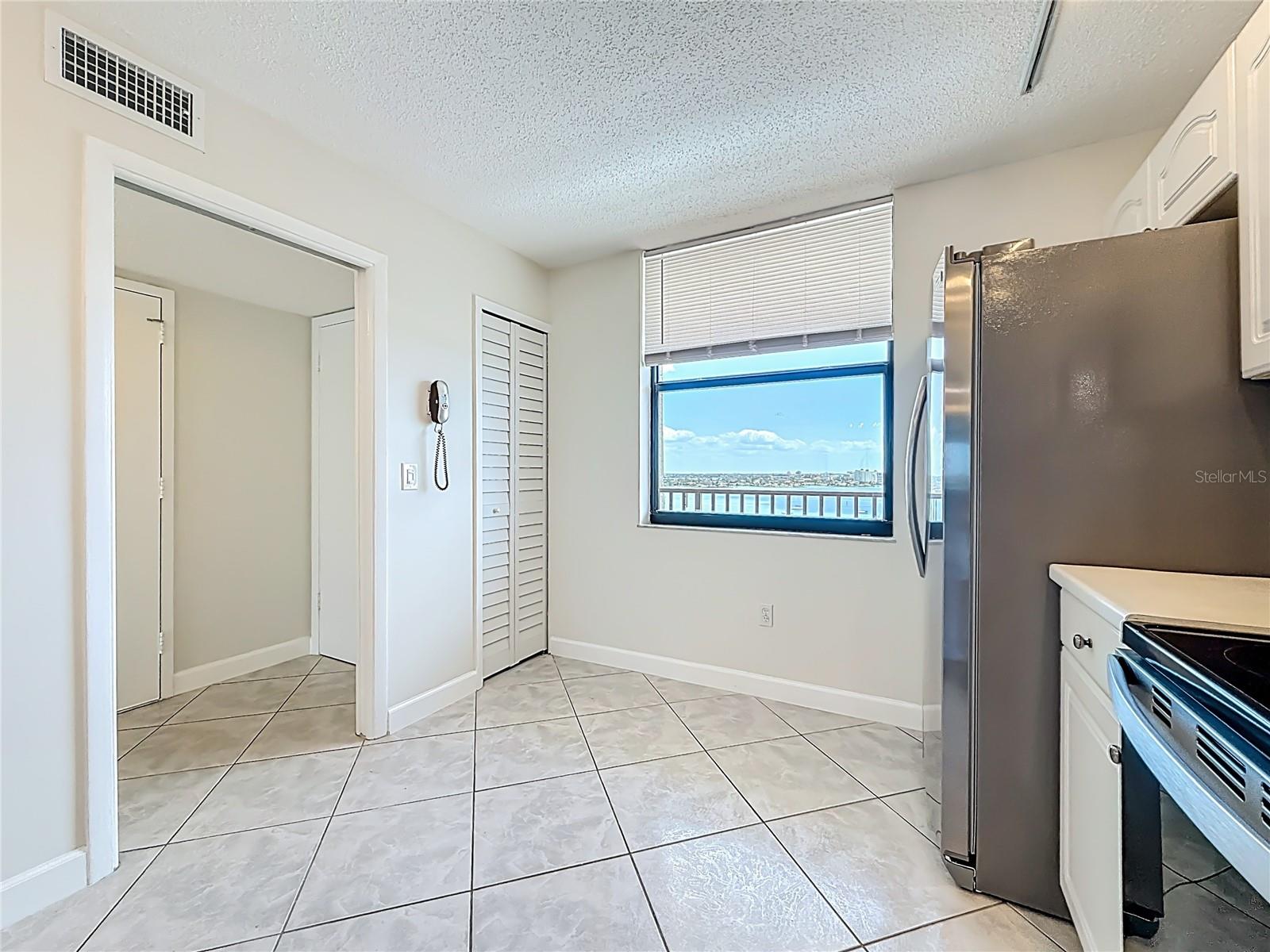 View of eating space in kitchen and closest pantry