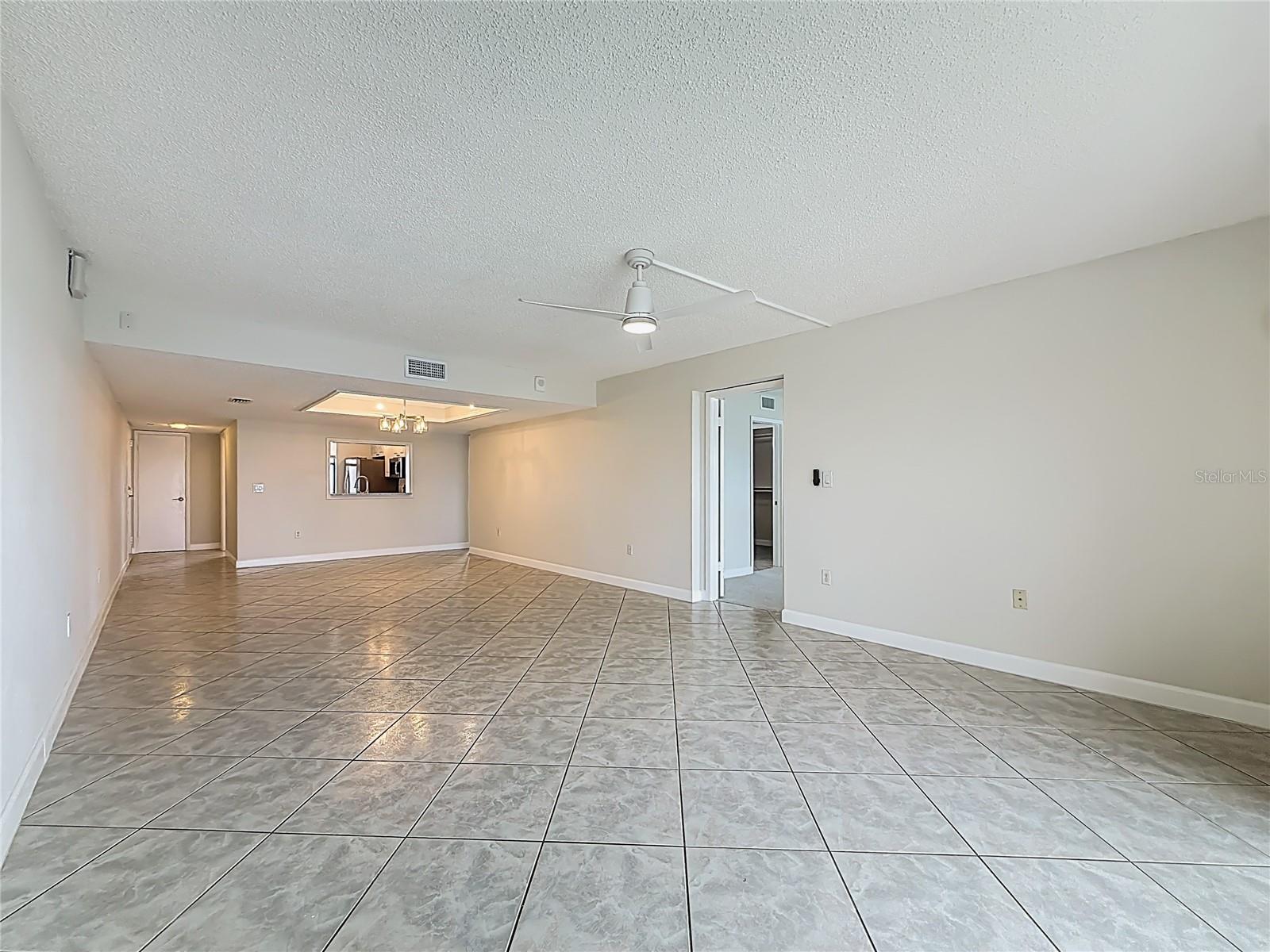 Looking back from the back of the condo into the kitchen - notice the open pass through from the kitchen
