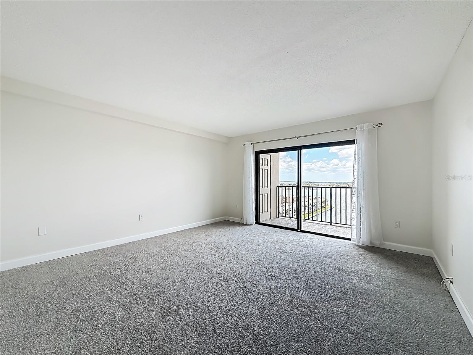 Primary bedroom with sliders to your balcony - offers magnificent water views