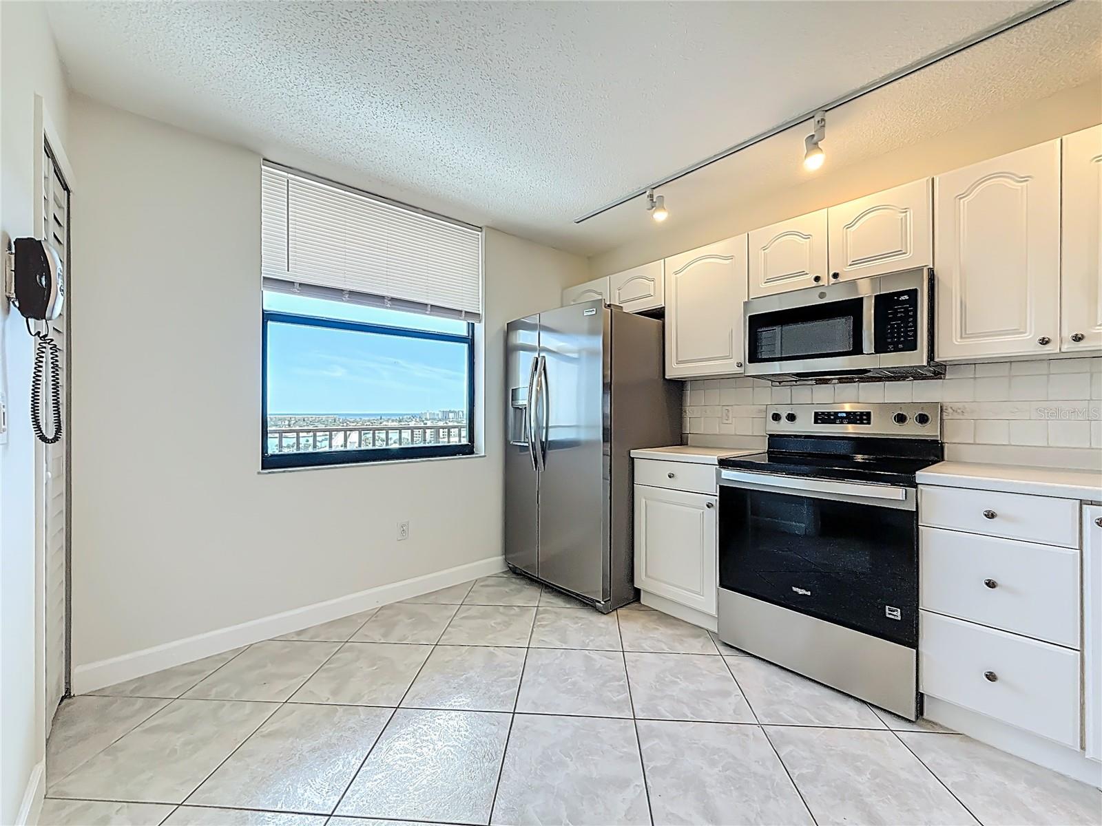 There is space for a table and chairs in the kitchen with views of the water and the bridge leading onto St. Pete Beach.