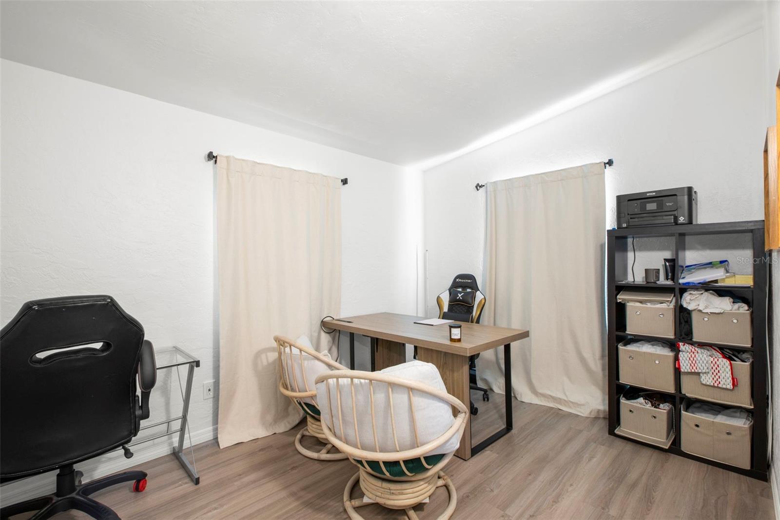 Well-sized secondary bedroom offers versatility for guests, office, or hobbies.