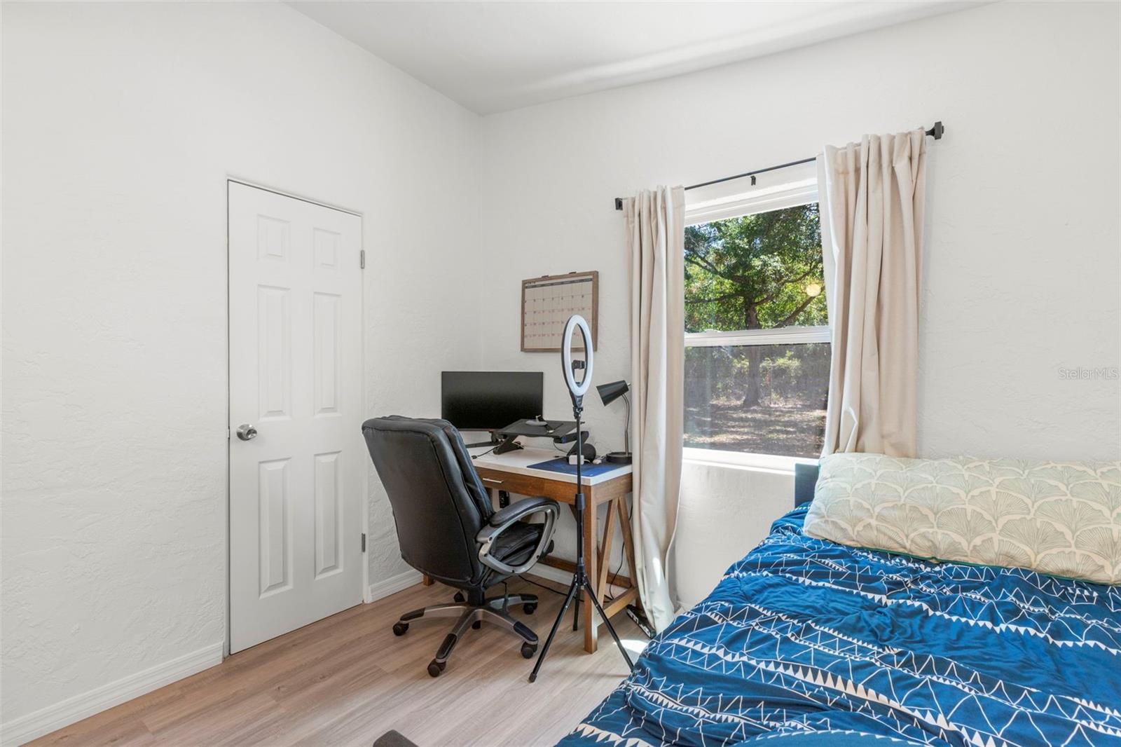 Versatile third bedroom offers comfortable proportions for guests, office, or day-to-day living.