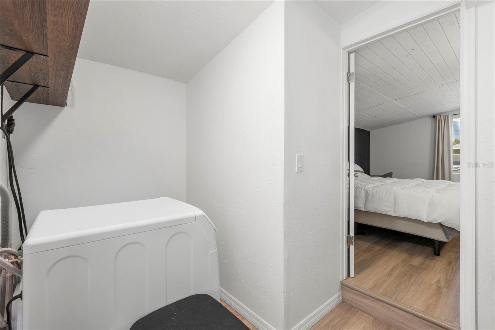 Laundry room located just off the primary bedroom adds everyday convenience and organization.