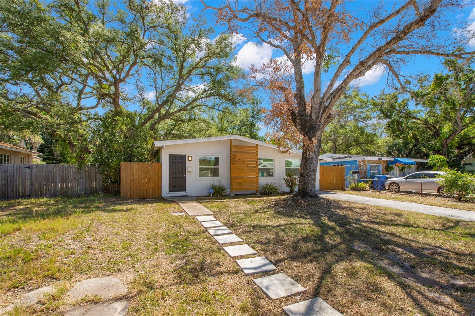 Fresh curb appeal with clean architectural lines, updated front fencing, and inviting front entry.