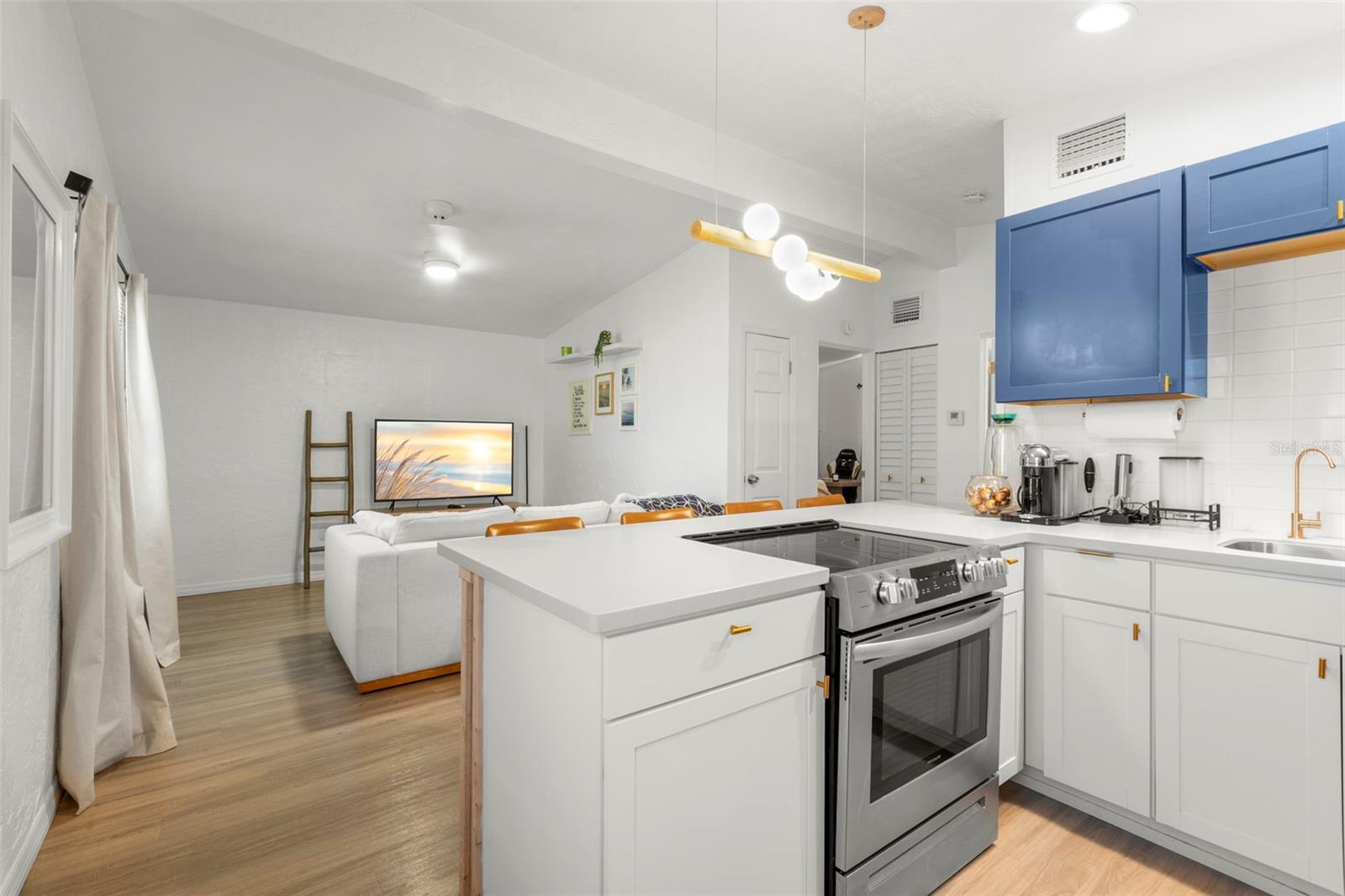 Open kitchen layout keeps the chef connected to the main living spaces.