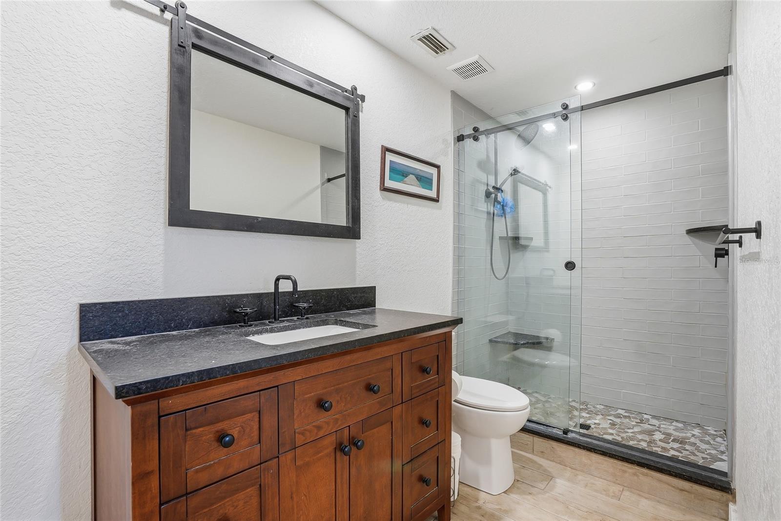 Second full bathroom with step in shower.