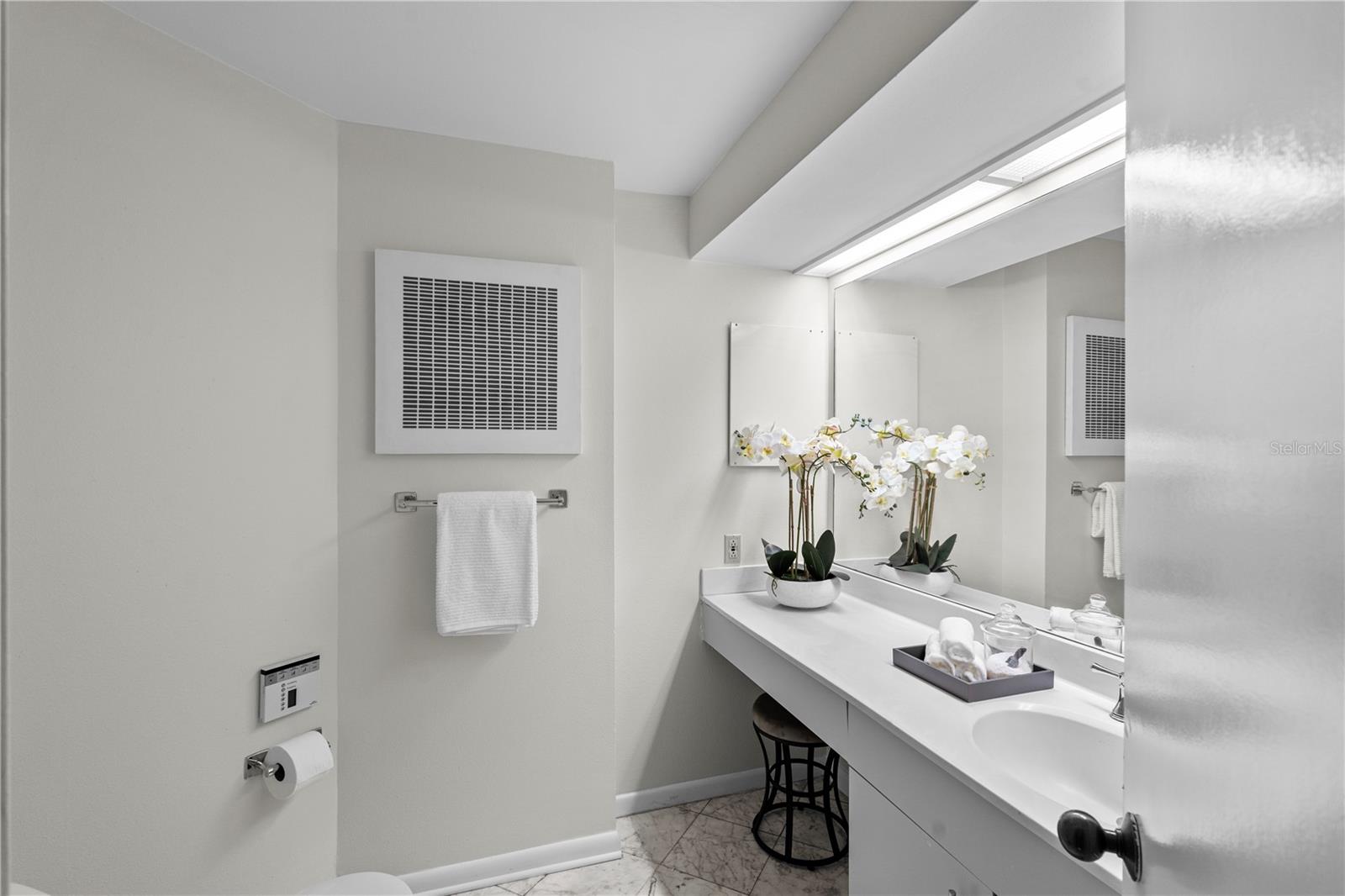 Half bath in the front of the unit