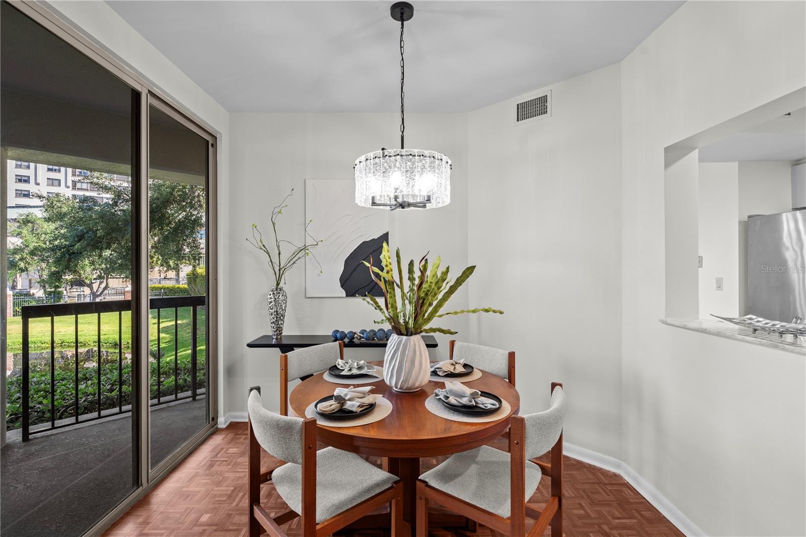 Dining Room with new lighting, new fresh paint - views of the water & access to the outdoor lviing area