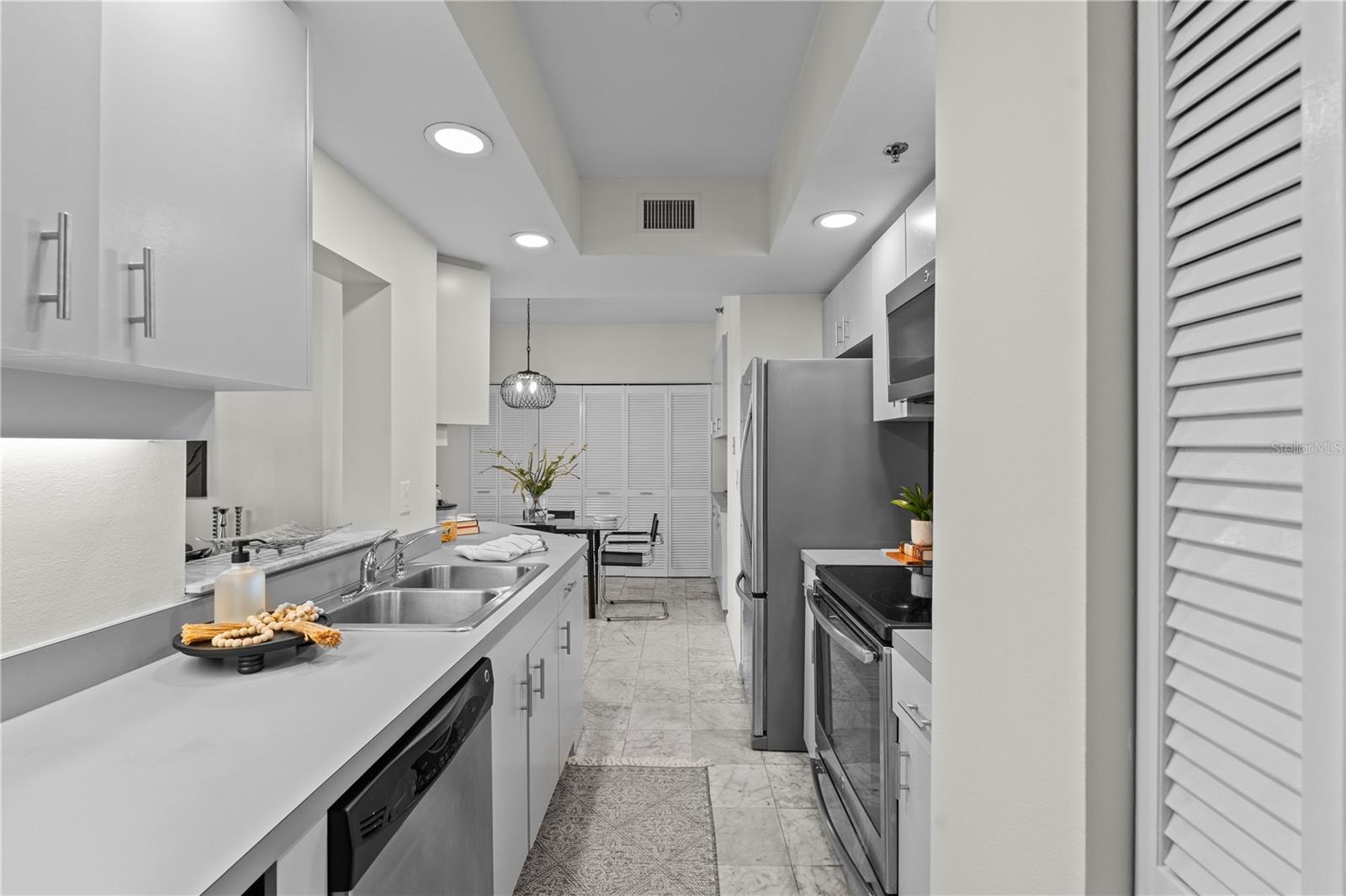 Light and bright kitchen with new lighting, fresh paint, new wine refrigerator