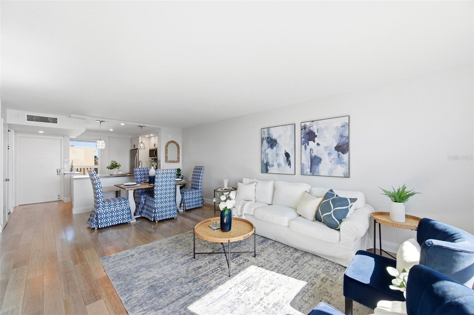 View from the living room looking into the dining area and kitchen.