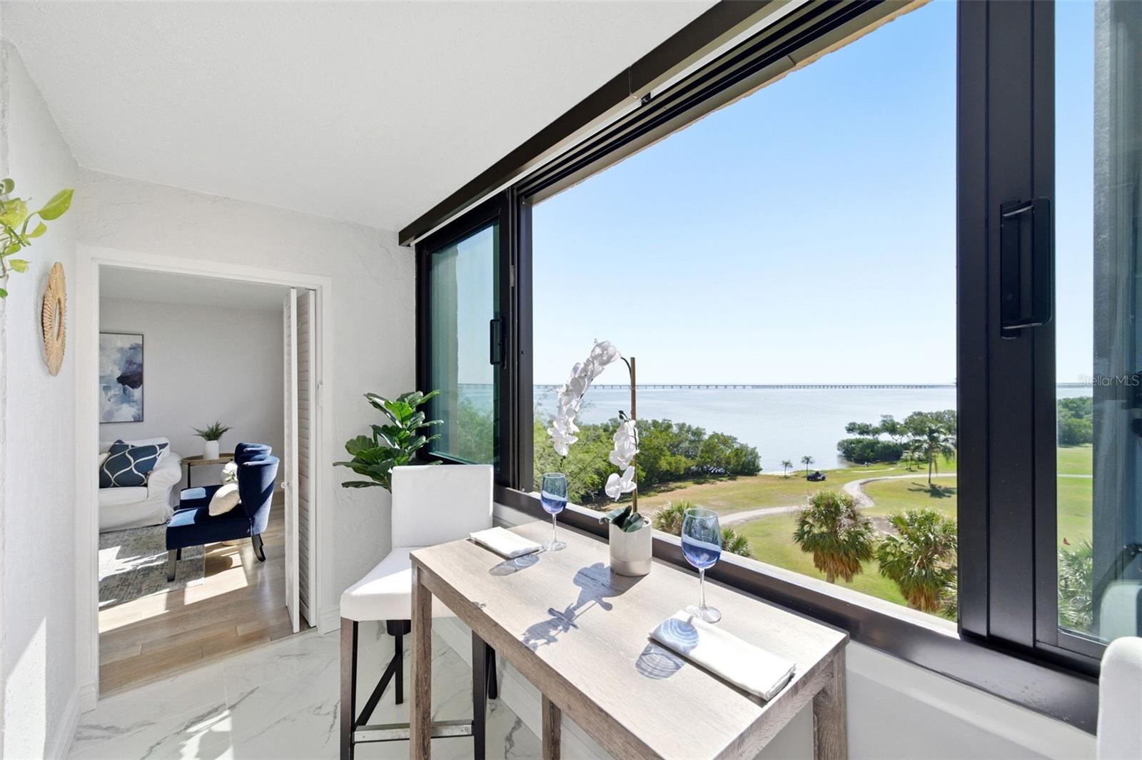 View of the 16th Hole, the Bayside Bridge and Tampa Bay from your sunroom!