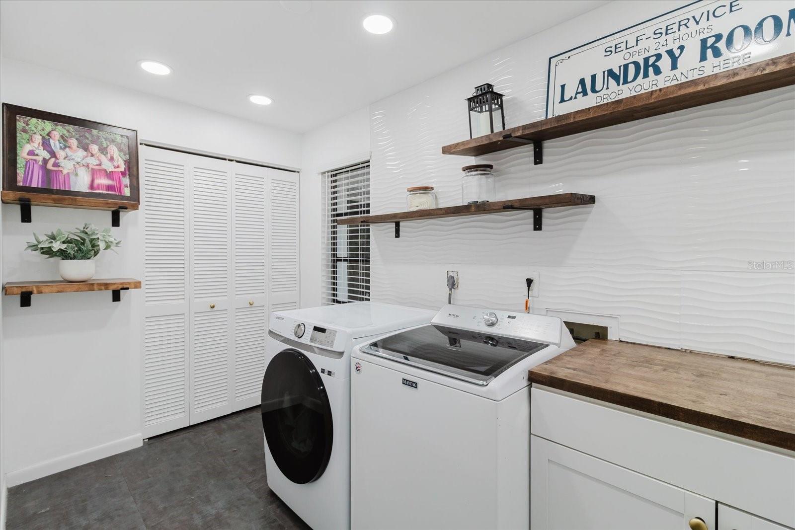 inside laundry room off bonus room