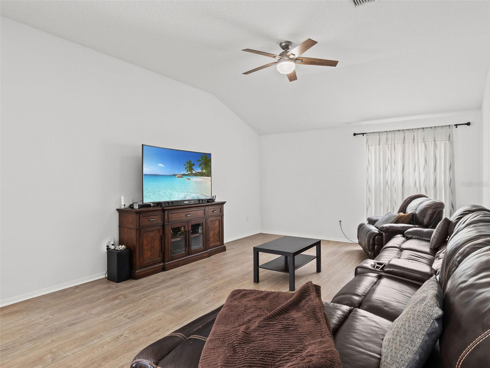 Comfortable and versatile living area with ample wall space and an open layout, offering endless possibilities for relaxation or entertainment.