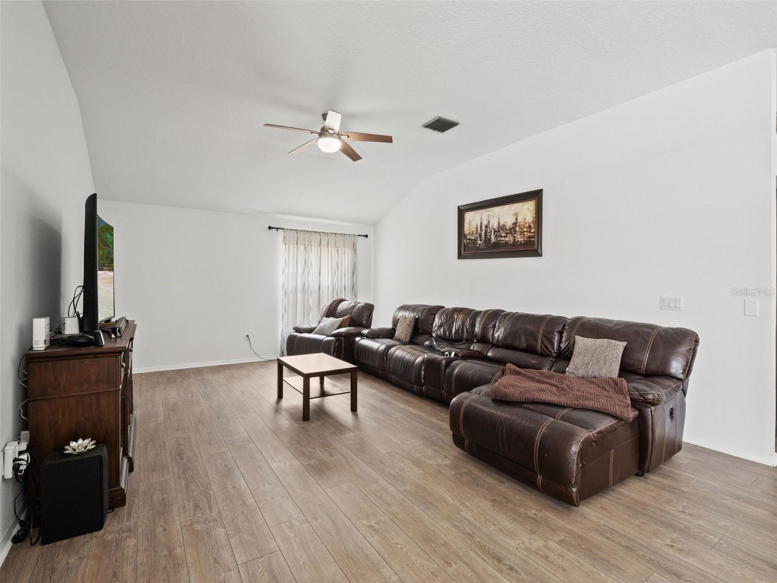 Bright and open secondary living space with clean lines and neutral tones, easily adaptable to suit a variety of lifestyles.