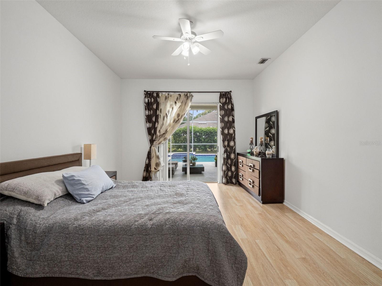 Generous layout with ample wall space and natural light, offering flexibility for additional seating or a cozy reading nook.