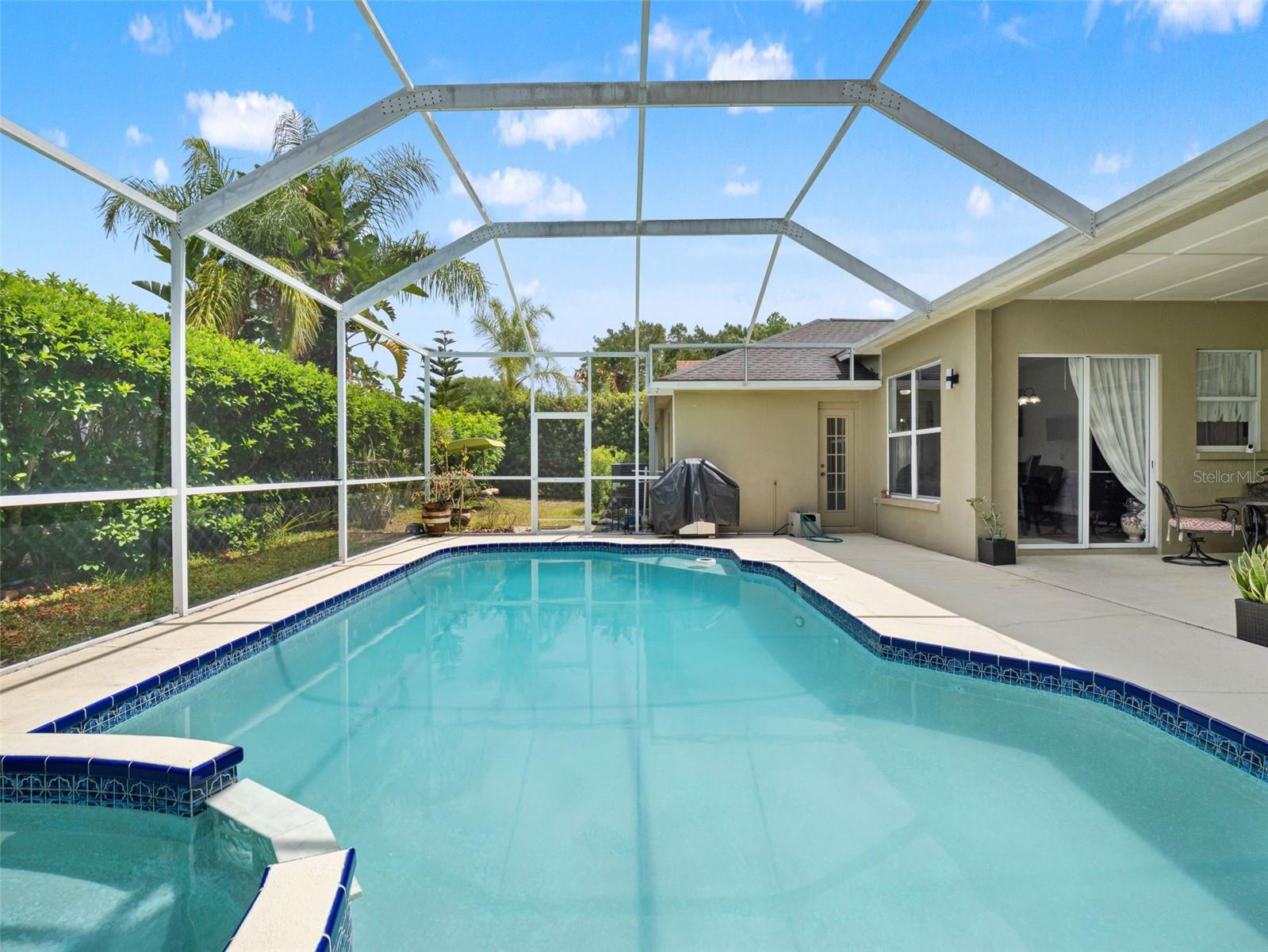 Generous pool layout with ample deck space for lounging, all within a screened enclosure that enhances comfort and usability.