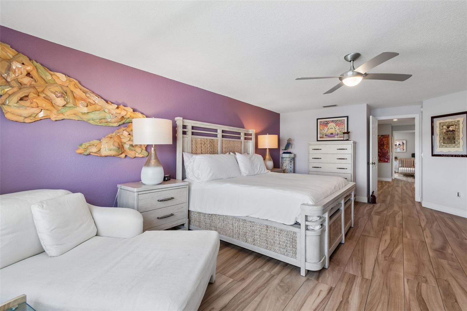 This primary bedroom is so large you can fit all your furniture