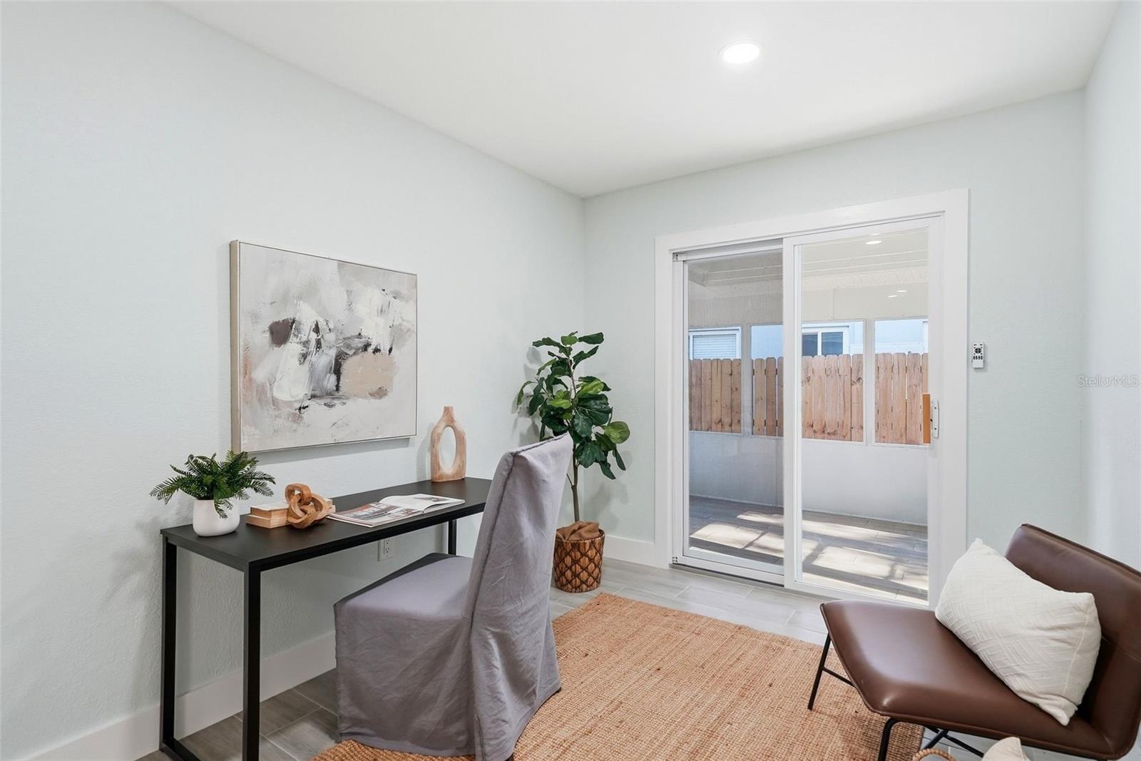 Sliding Glass Doors out to the screened-in lanai grill area