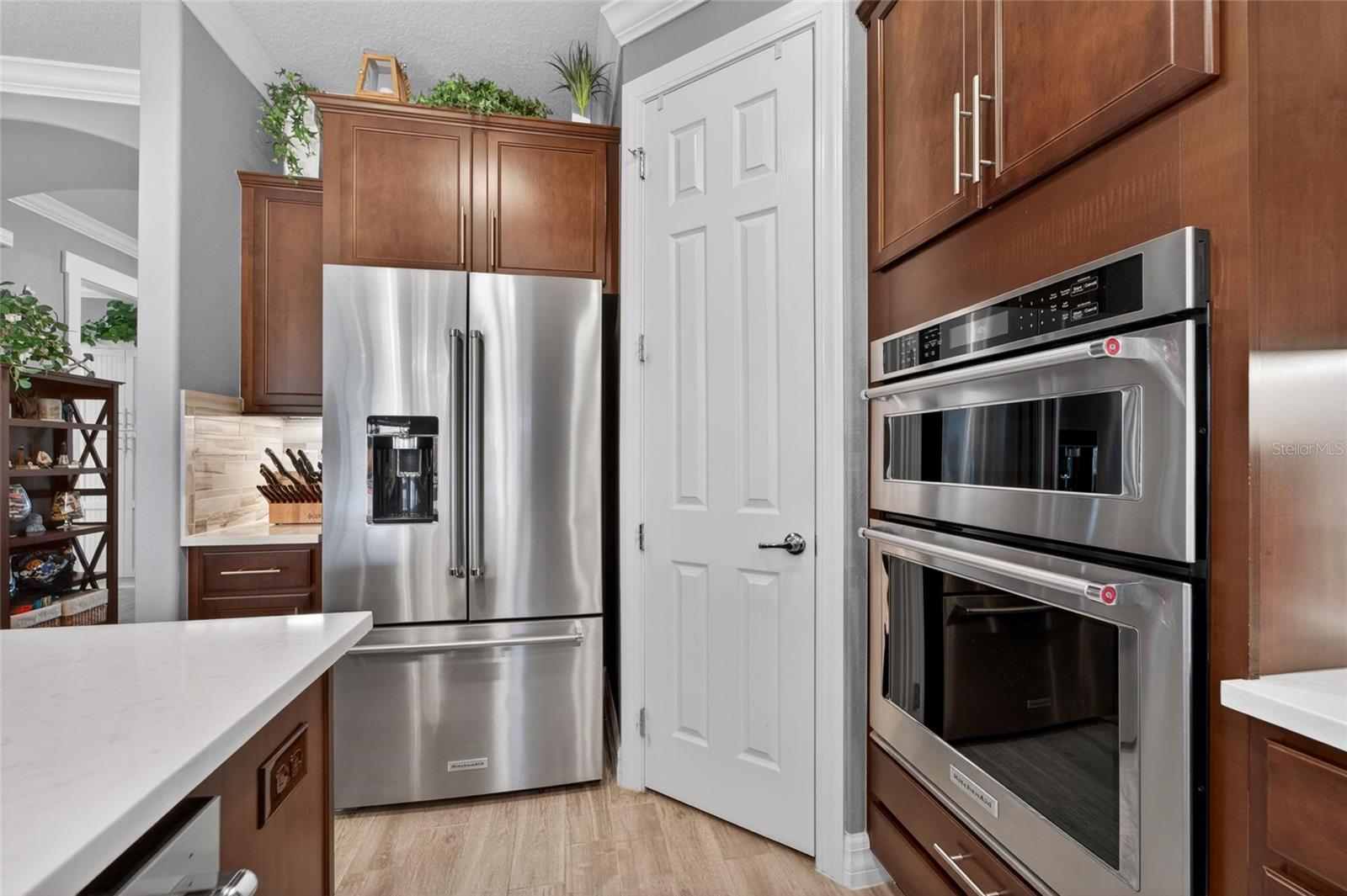 Kitchen pantry with wooden built in shelves