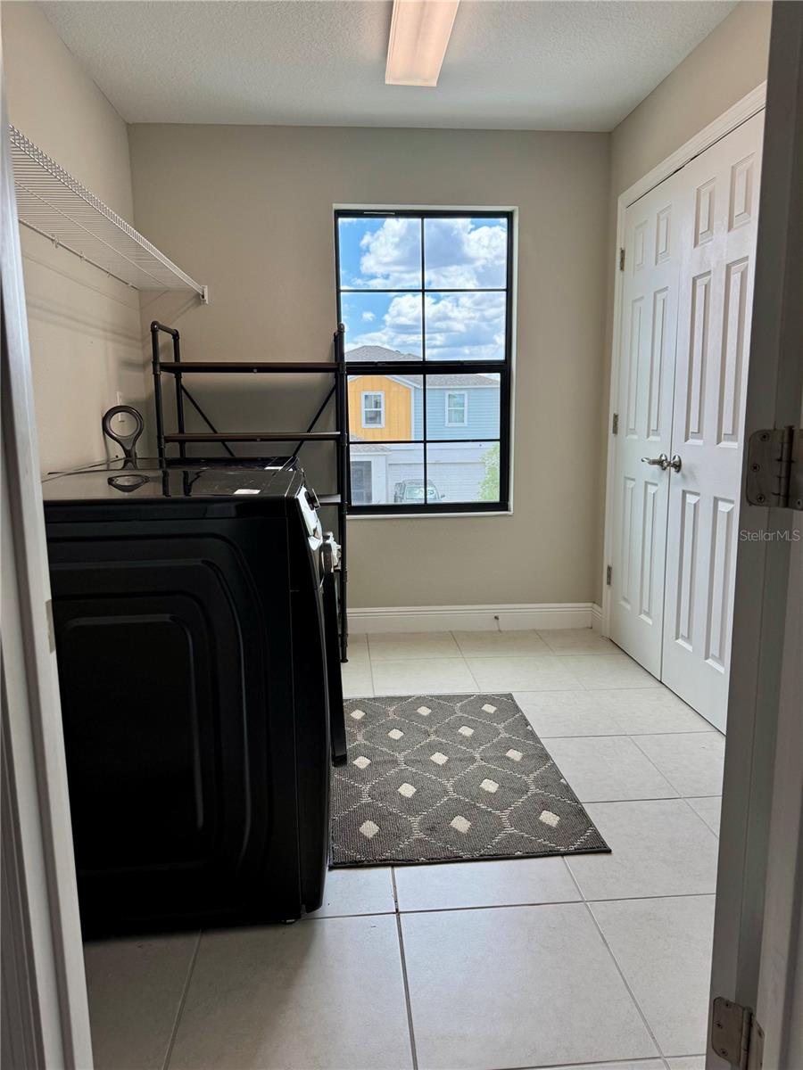 Spacious Laundry room with large closet.