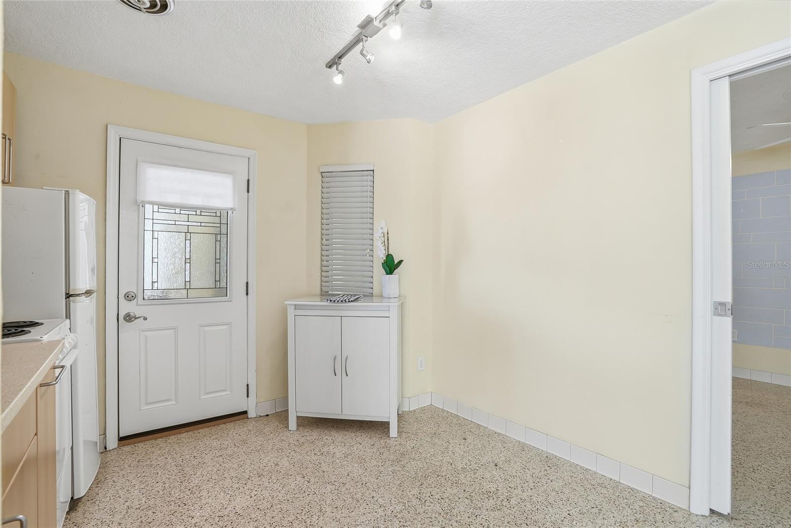 Kitchen with secondary door entrance making groceries and deliveries a breeze.