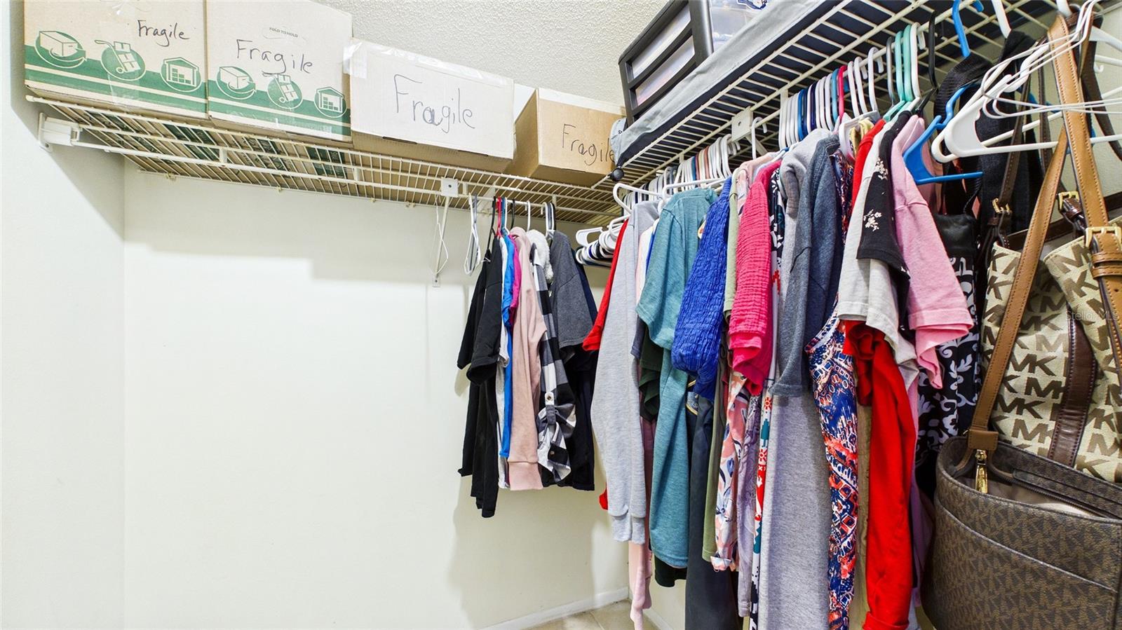 Primary bedroom walk-in closet