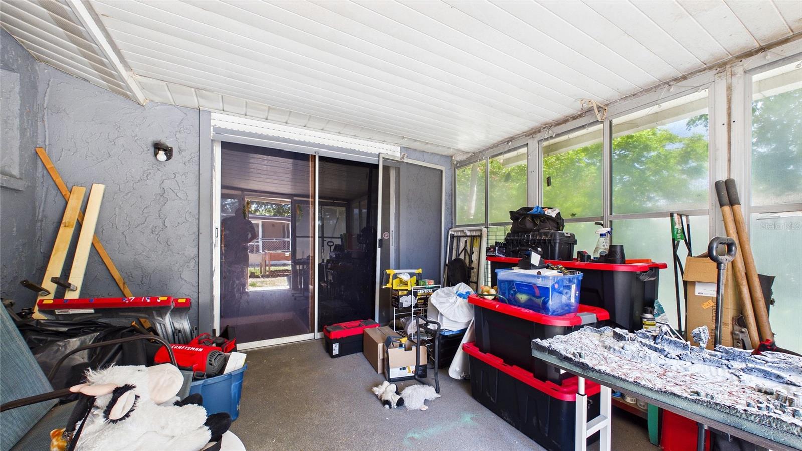 Screened in porch overlooking the yard.