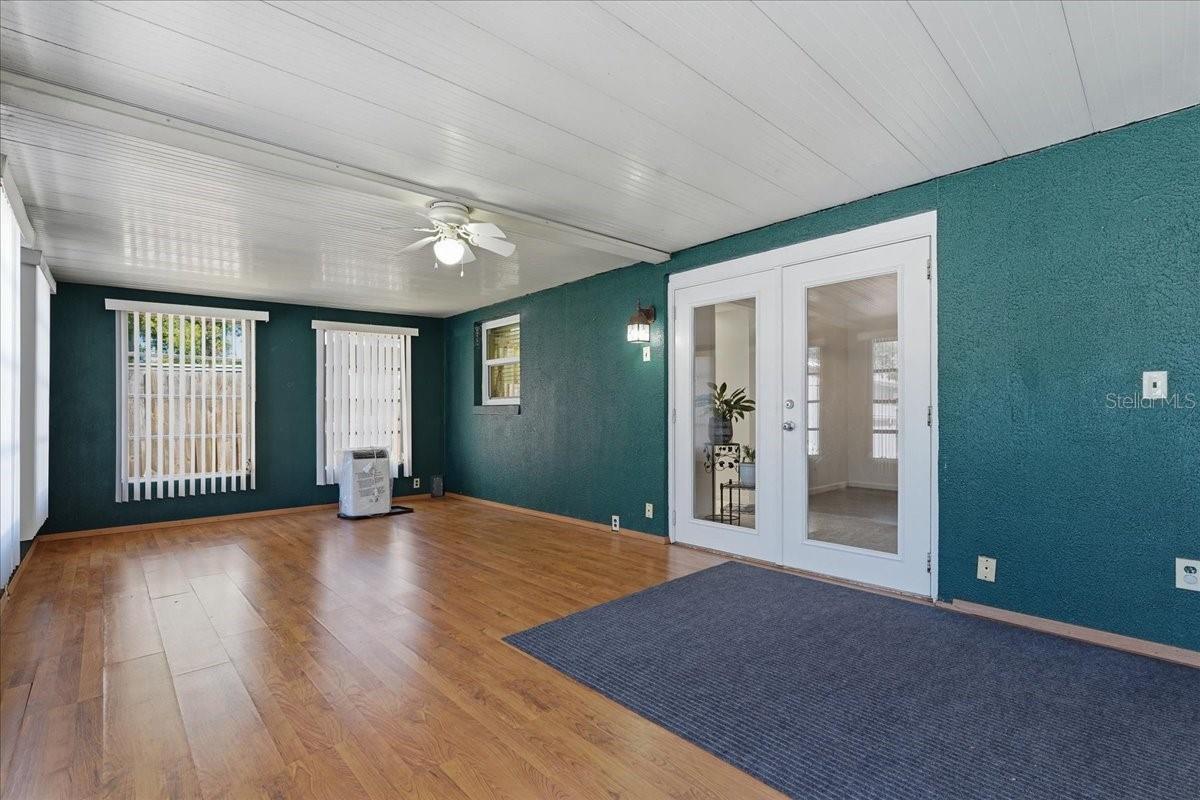 Florida Room with French Door into Living Room/Dining Room