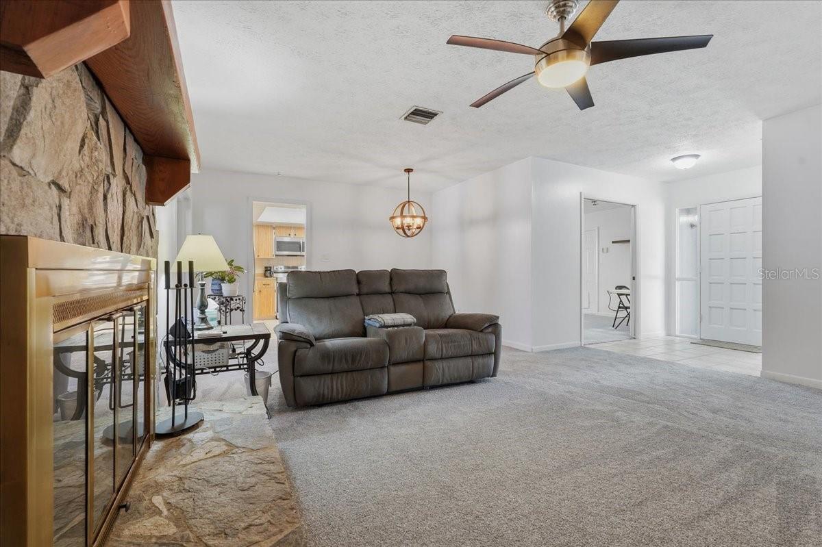 Living Room with Lighted Ceiling Fan