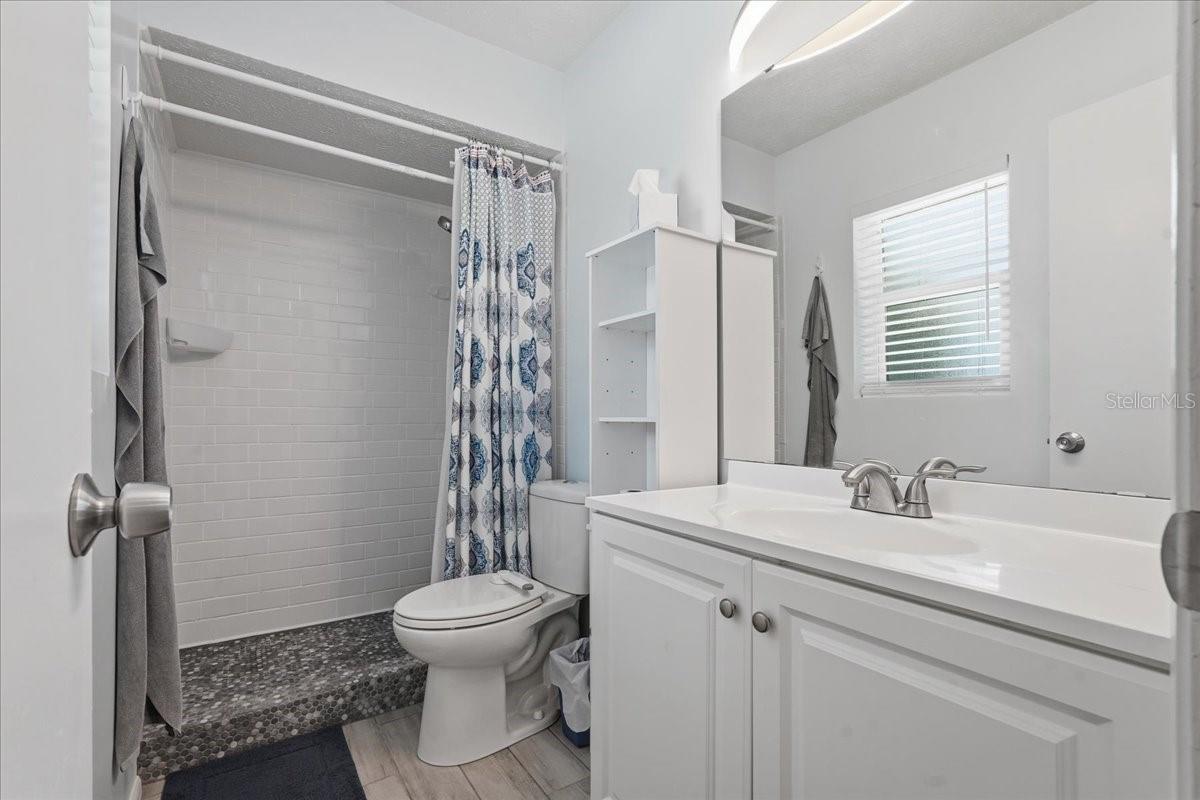En Suite Bathroom with Shower and Tiled Floor