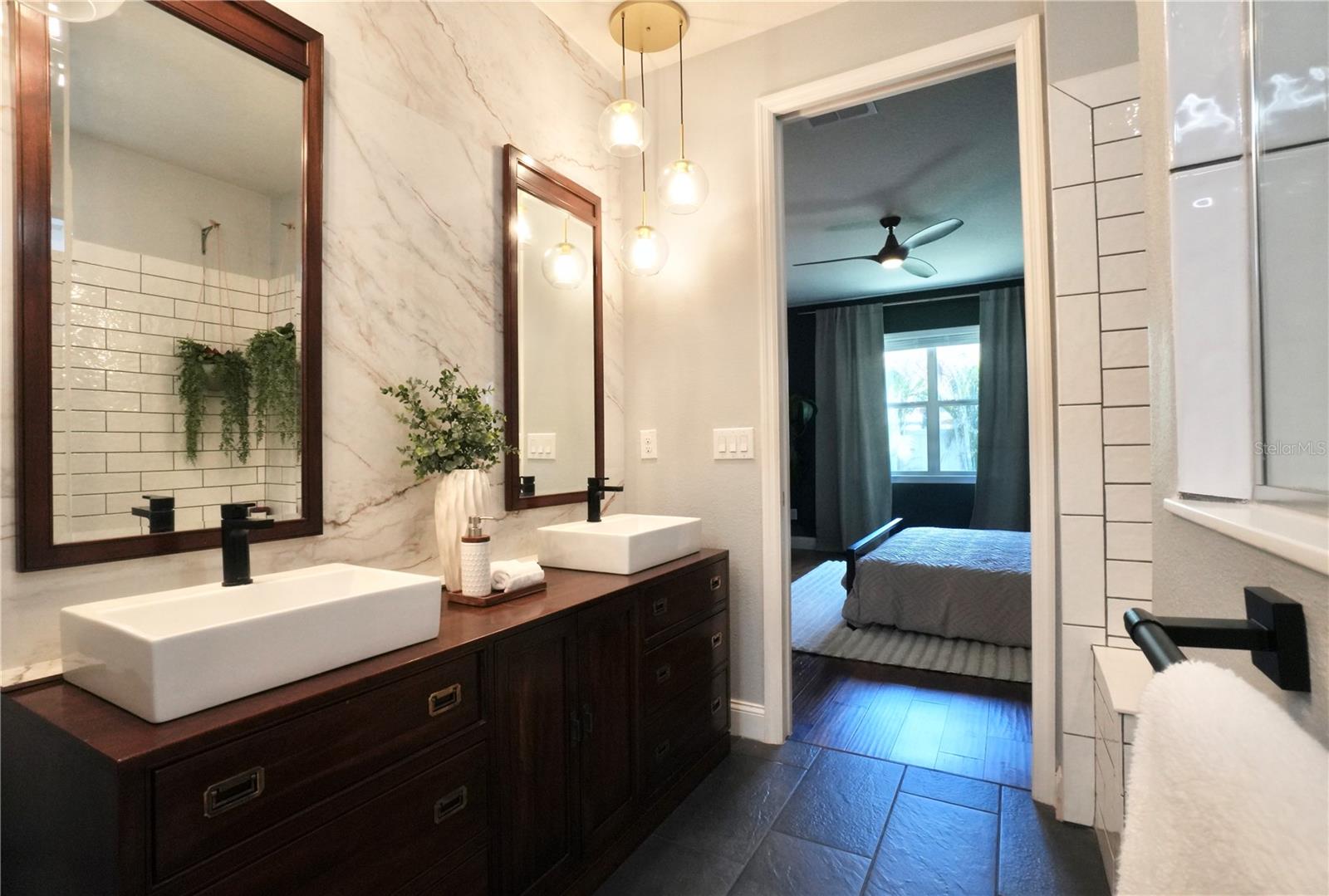 Updated lighting, marble feature wall and custom vanity.
