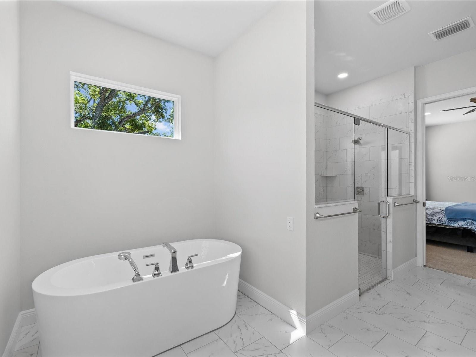 Unwind in the luxurious soaking tub within the primary bath