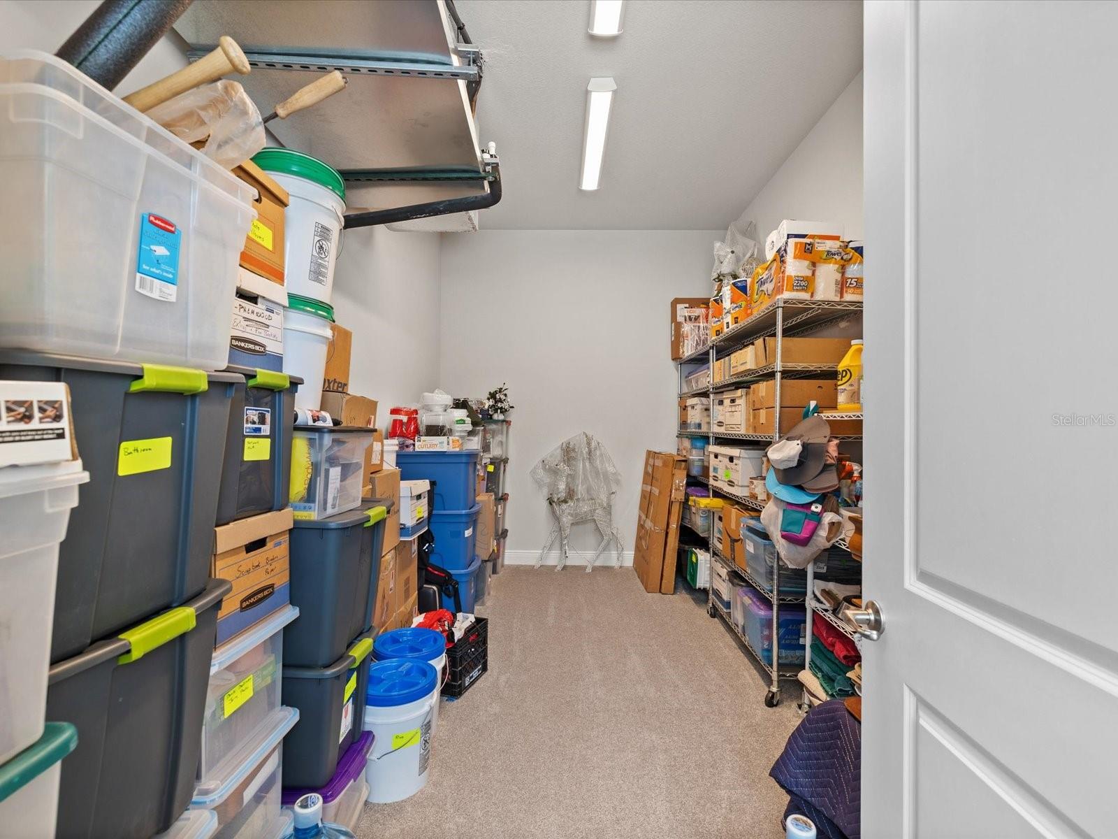 An expansive garage with a climate controlled bonus room