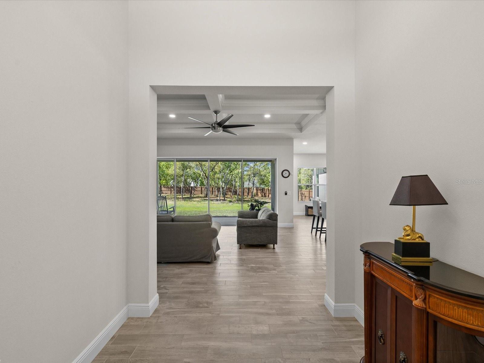 An open, elegant view from the foyer sets the tone for the home
