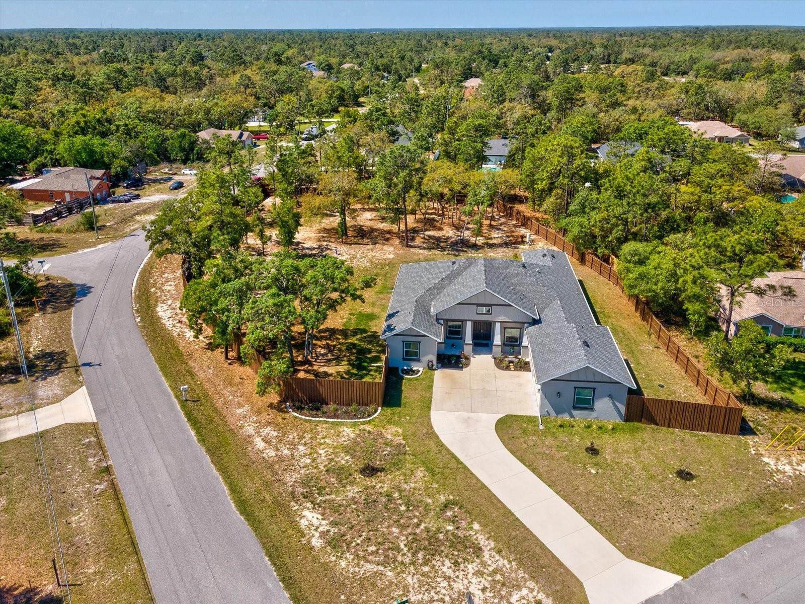 This new construction home sits proudly on a spacious 1.27-acre corner lot, offering room, privacy, and endless possibilities