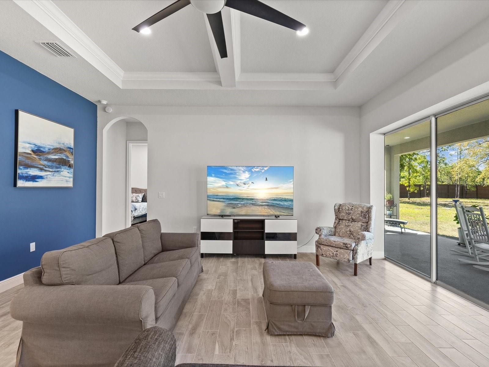 An architectural delight with beautiful high coffered ceilings that add depth and elegance