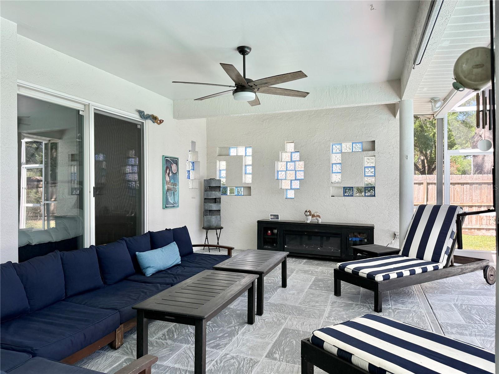 Covered Patio with Glass Sliders from the Formal Living Area, the Primary Bedroom and the Kitchen.