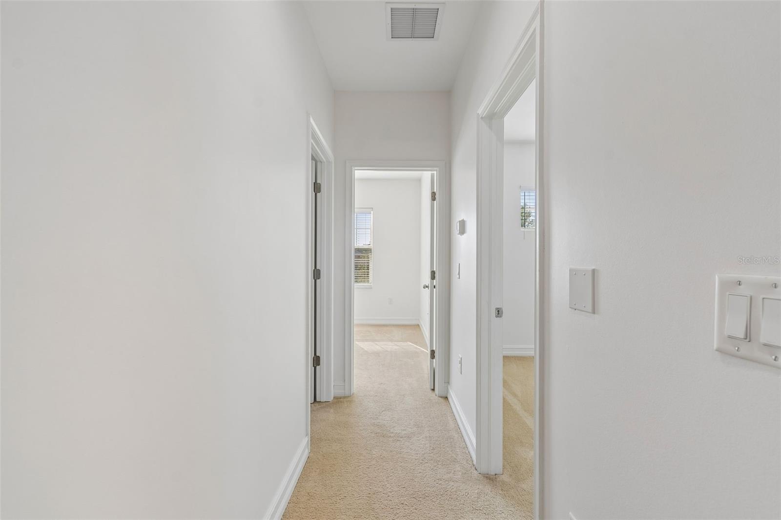 Hallway to the three bedrooms