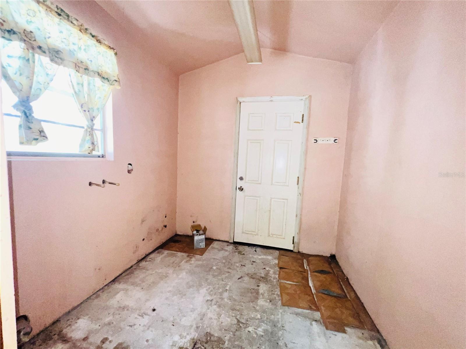 INSIDE UTILITY ROOM AND ACCESS TO BACK YARD