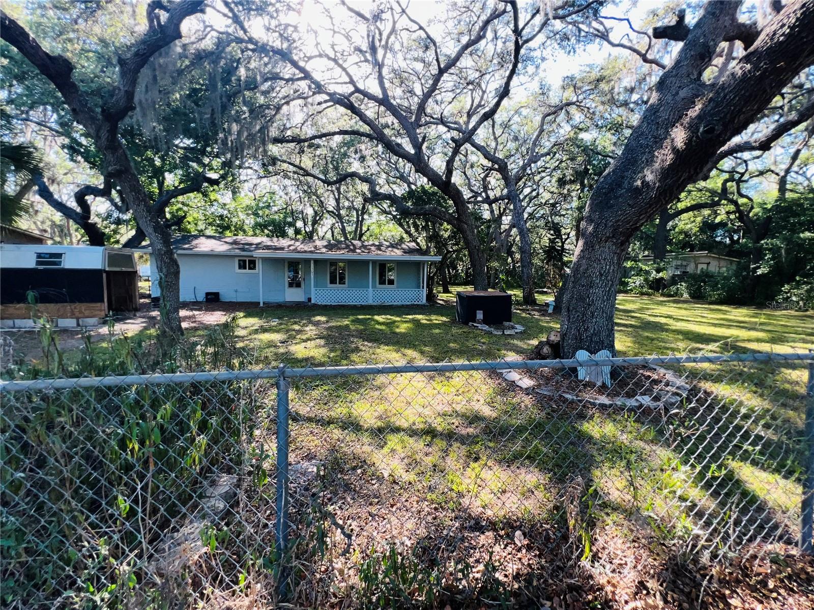 FRONT OF HOUSE COMPLETLY FENCED IN