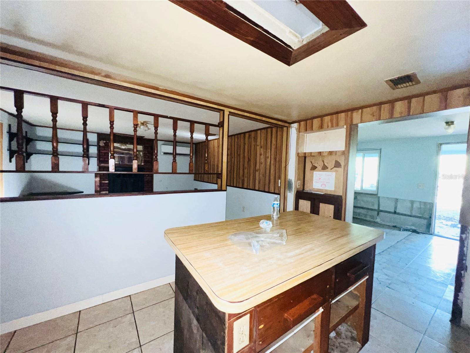 VIEW FROM KITCHEN LOOKING OUT OVER FAMILY ROOM AND DINING ROOM