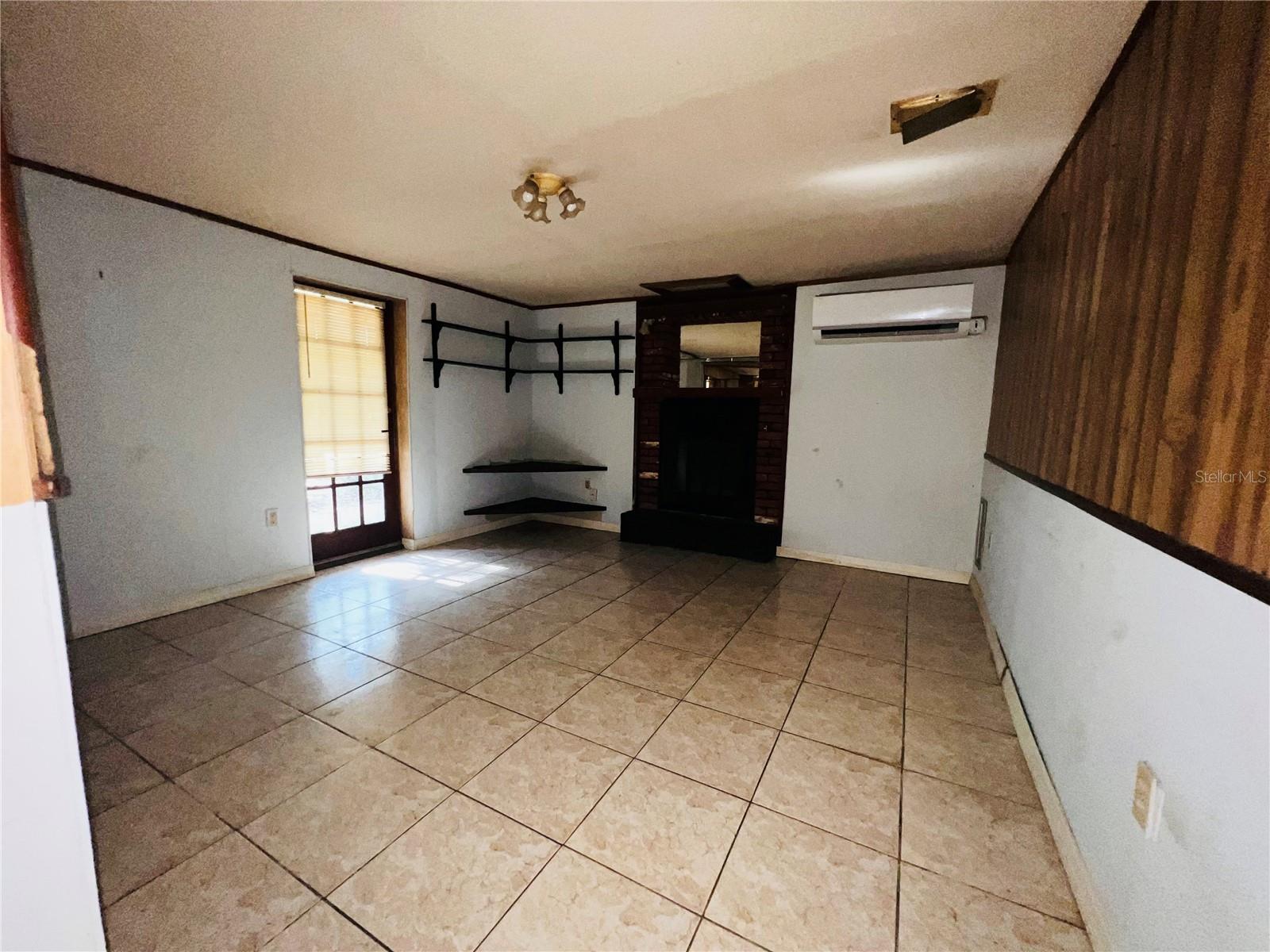 VIEW FROM KITCHEN LOOKING AT AT FAMILY ROOM AND FIRE PLACE